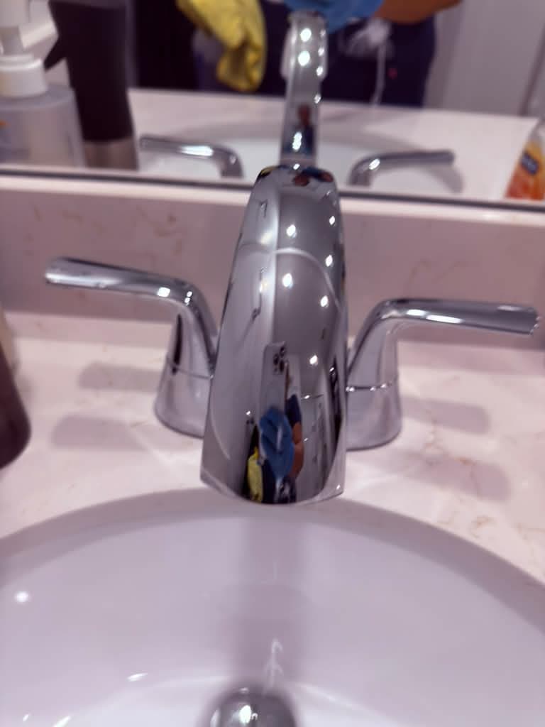 Polished chrome bathroom faucet after cleaning